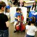 Ann Arbor resident Kaden Thornton, 7, plays a cello on an adjustable-height chair during the Mini Maker Faire on Saturday, June 8. Daniel Brenner I AnnArbor.com